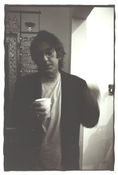 what's in the cup and why is he gesturing so wildly...
